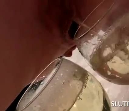 Kinky blonde tramp filling three glasses with her piss